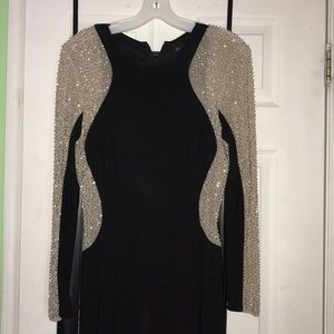 Long black prom dress with gem detail.
